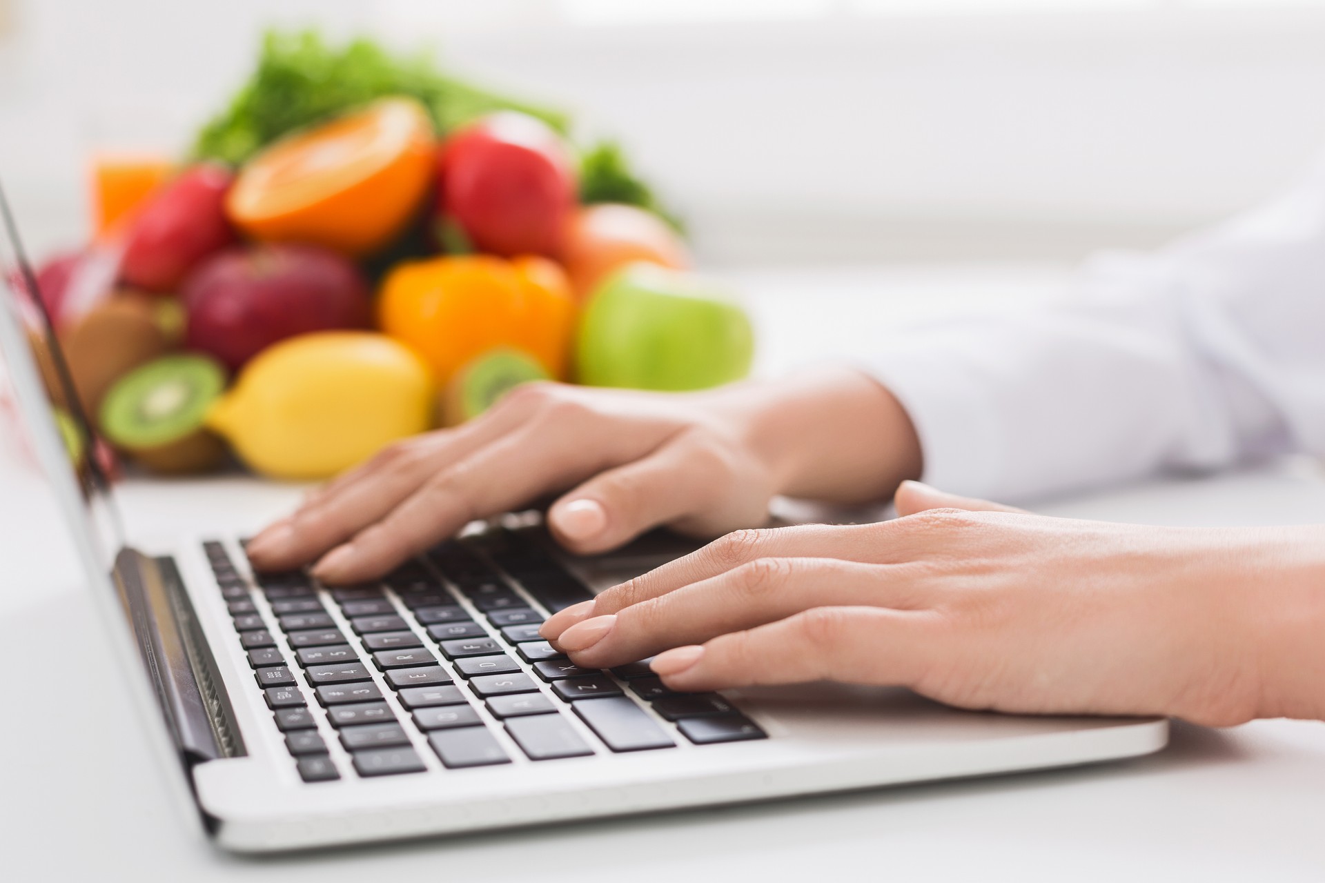 dietitian typing treatment to patient via internet